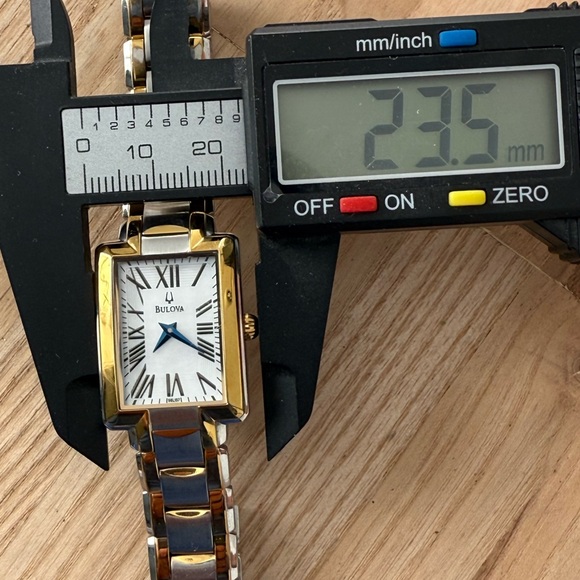 Bulova Curvex Luxury Watch Two-Tone Bracelet White Rectangular Dial Blue Hands